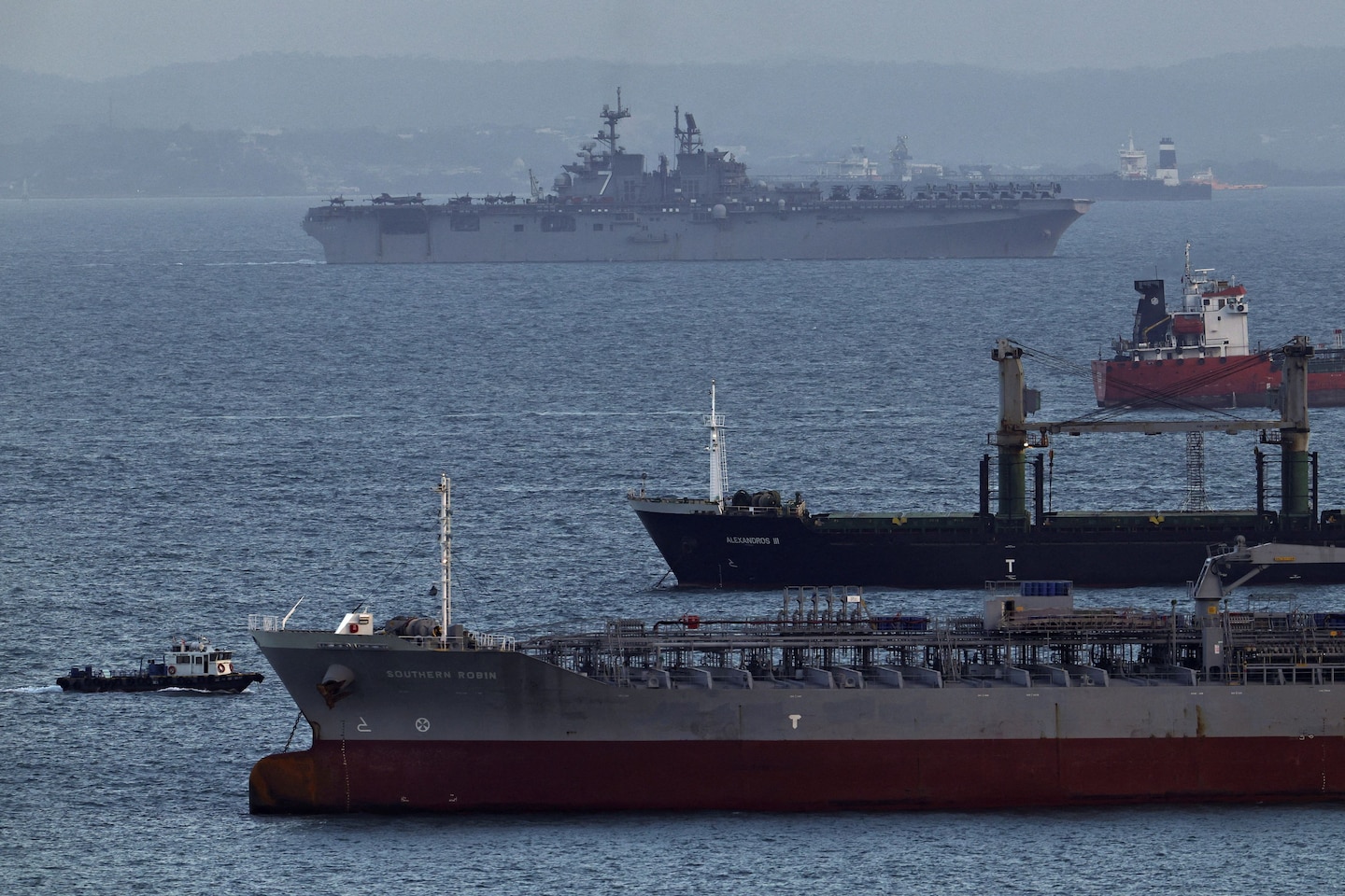 Trump threats, U.S. troop build-up raise specter of battle for Hormuz